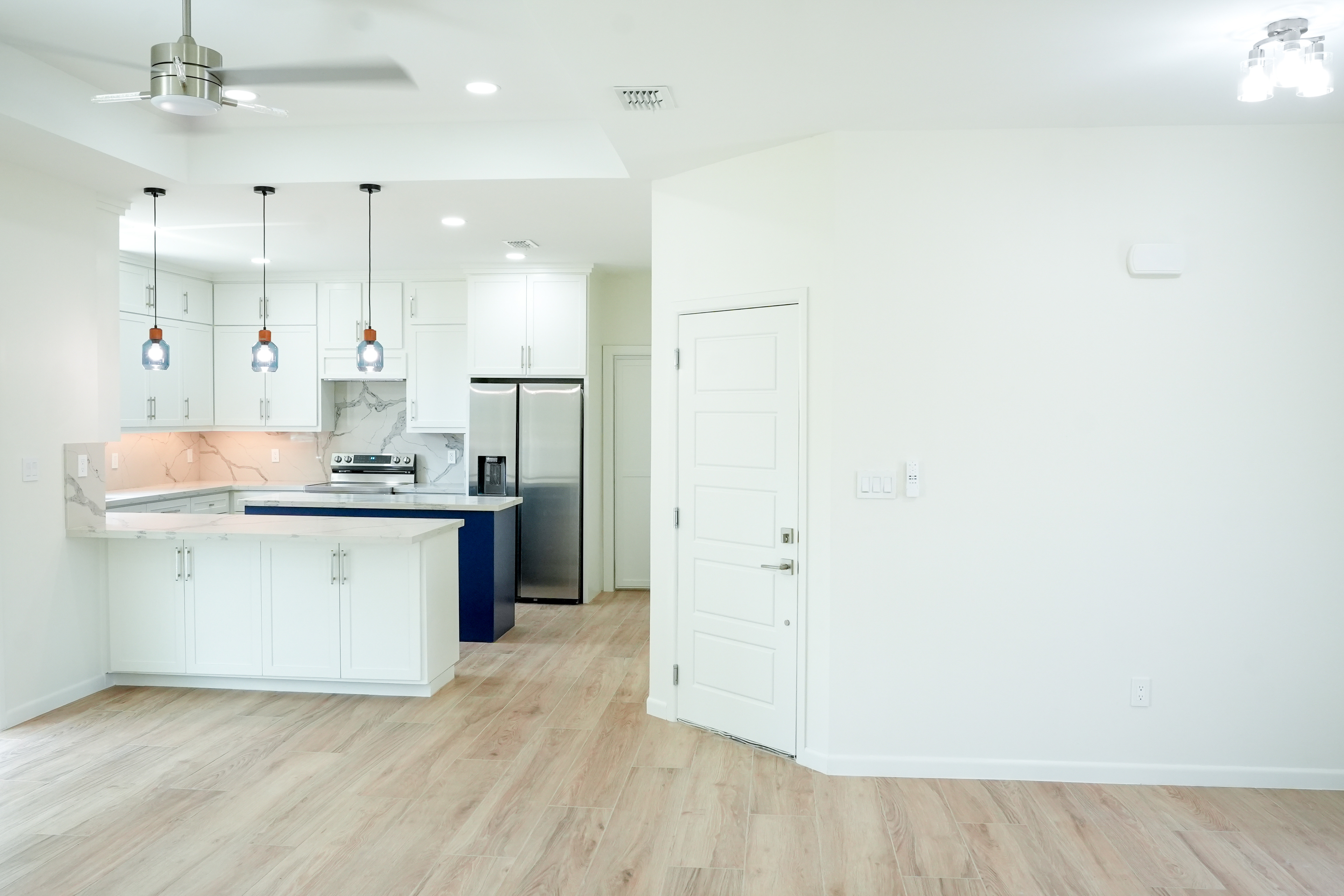 The Romero Residence — open-concept kitchen from the living area