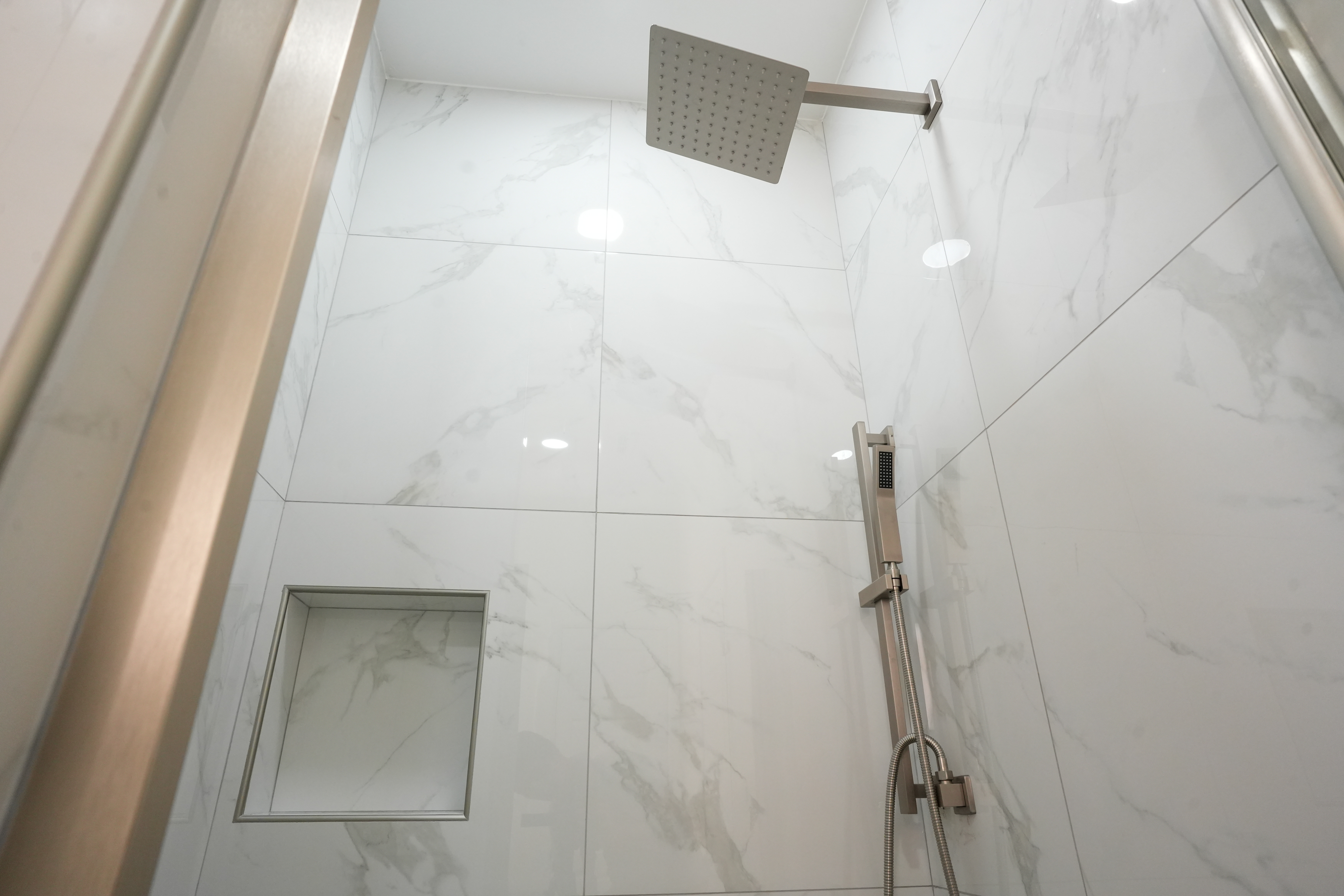 The Romero Residence — primary bath shower with rain head